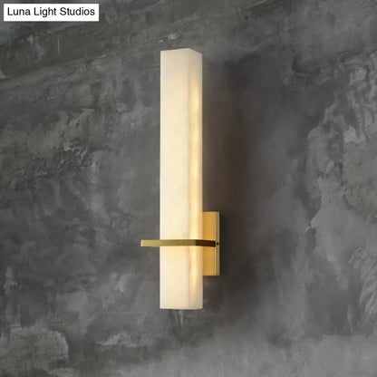 Modern rectangular wall sconce with frosted opal glass and brushed brass hardware for minimalistic marble wall 110v-120v lighting