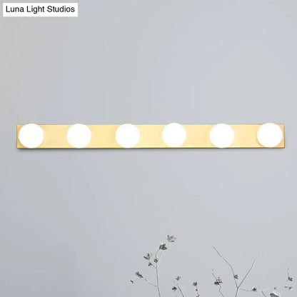 Gold-finished rectangular wall-mounted vanity lighting fixture with five open bulb circular lights for bathroom use
