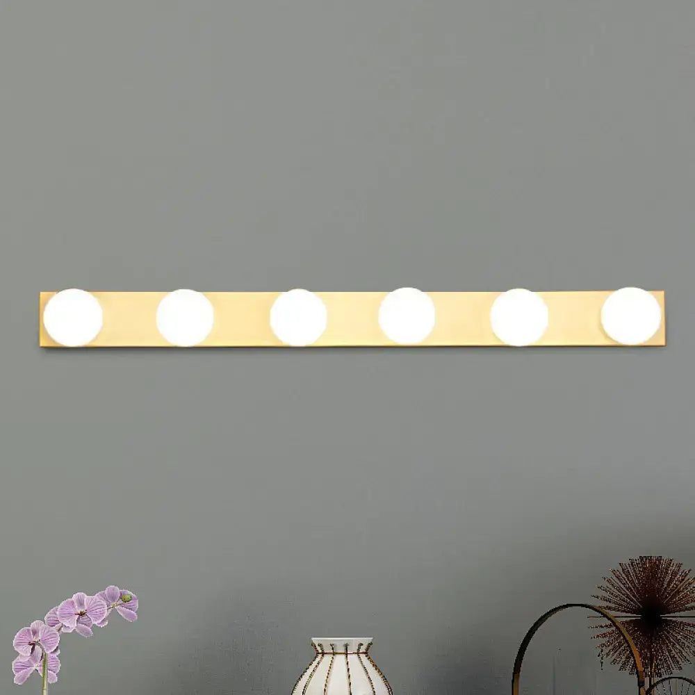 Gold-colored minimalistic vanity lighting fixture with five open bulb vanity lights for bathroom use