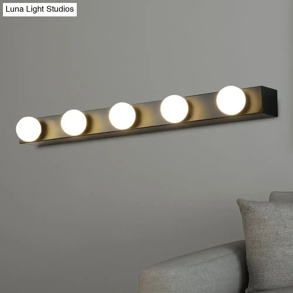 Minimalistic white vanity lighting fixture with four warm white open bulb lights in a sleek black metal bar