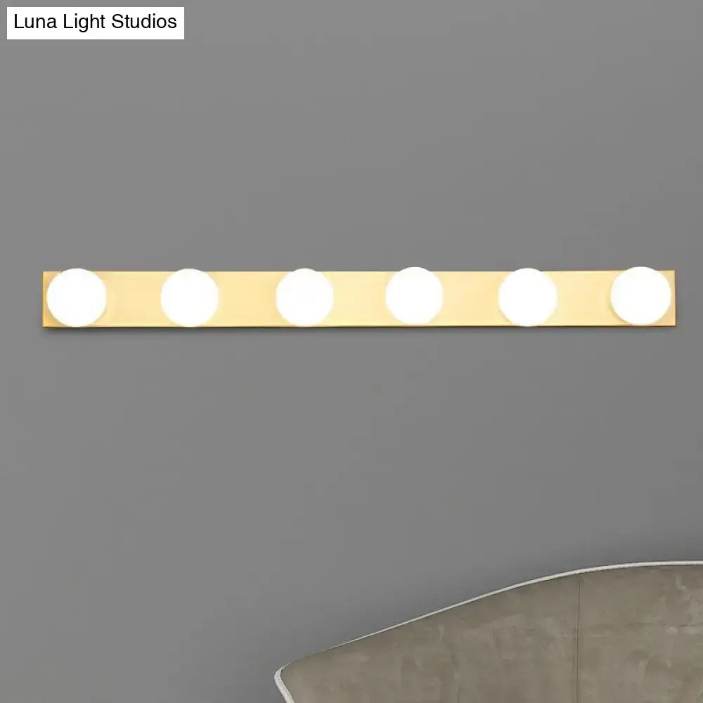 Gold-finished vanity lighting fixture with five open bulb lights for bathroom minimalistic white 4 light setup