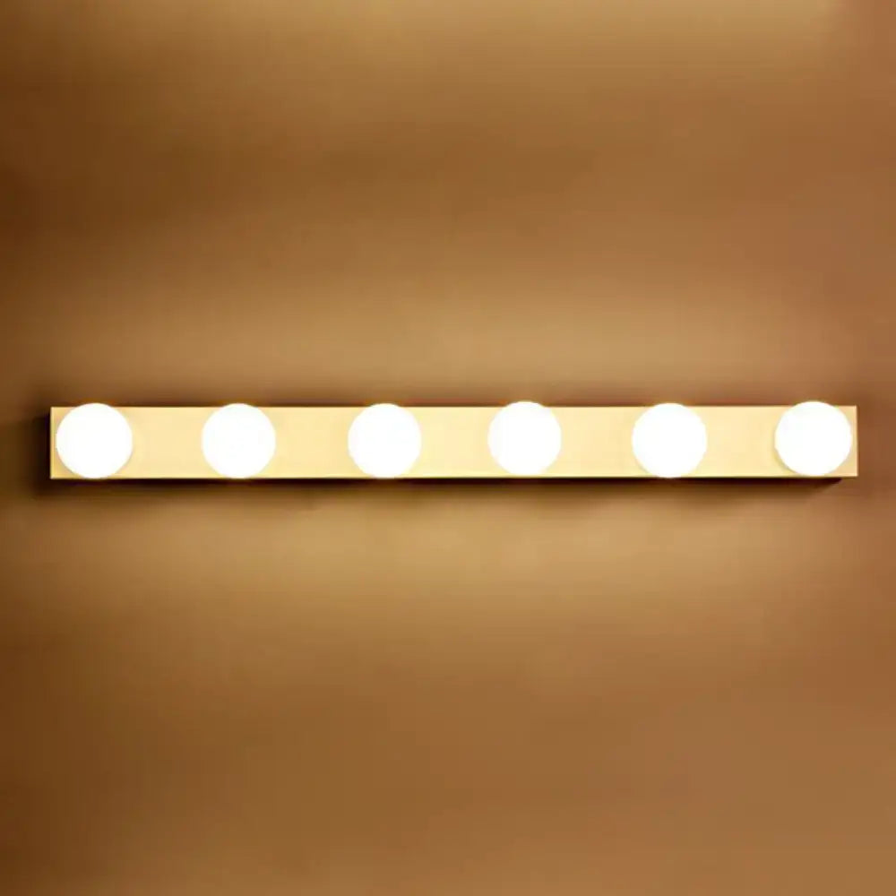 Gold-toned vanity lighting fixture with five open bulb circular lights for bathroom use