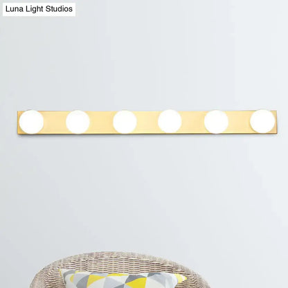 Gold-finished vanity lighting fixture with five open bulb lights for minimalistic bathroom vanity lighting
