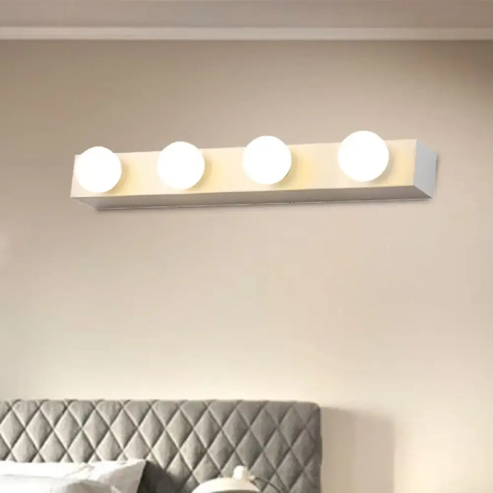 Minimalistic white vanity lighting fixture with four round open bulb lights for bathroom use