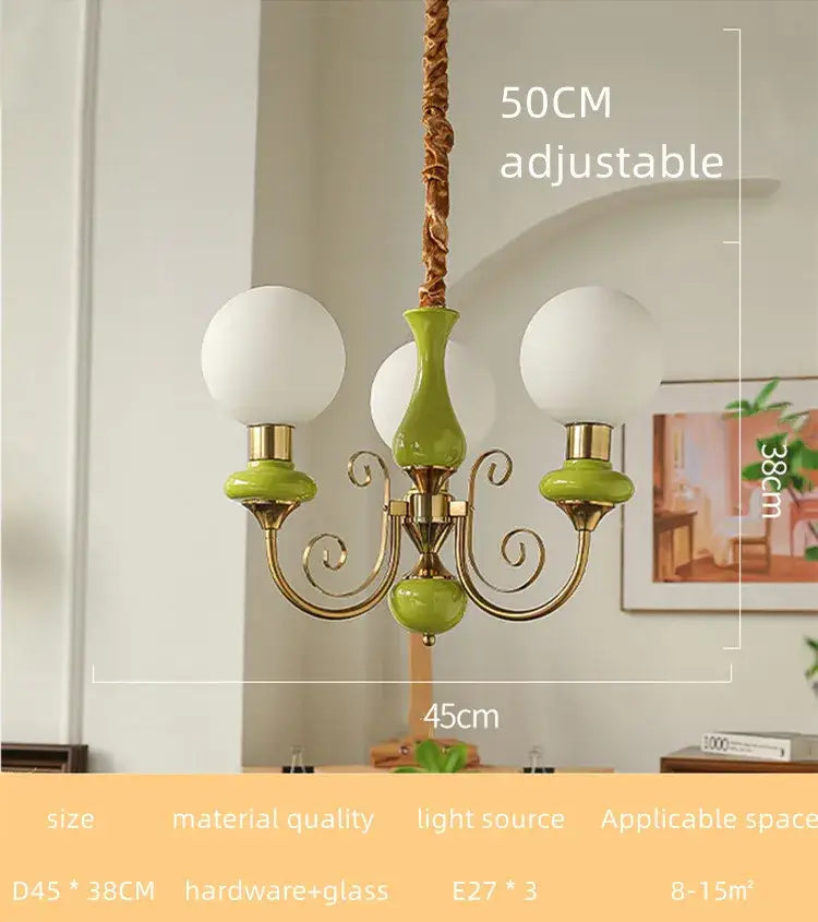 A charming mint and gold cream style led chandelier with three frosted glass globes for dining room decorbites cream style
