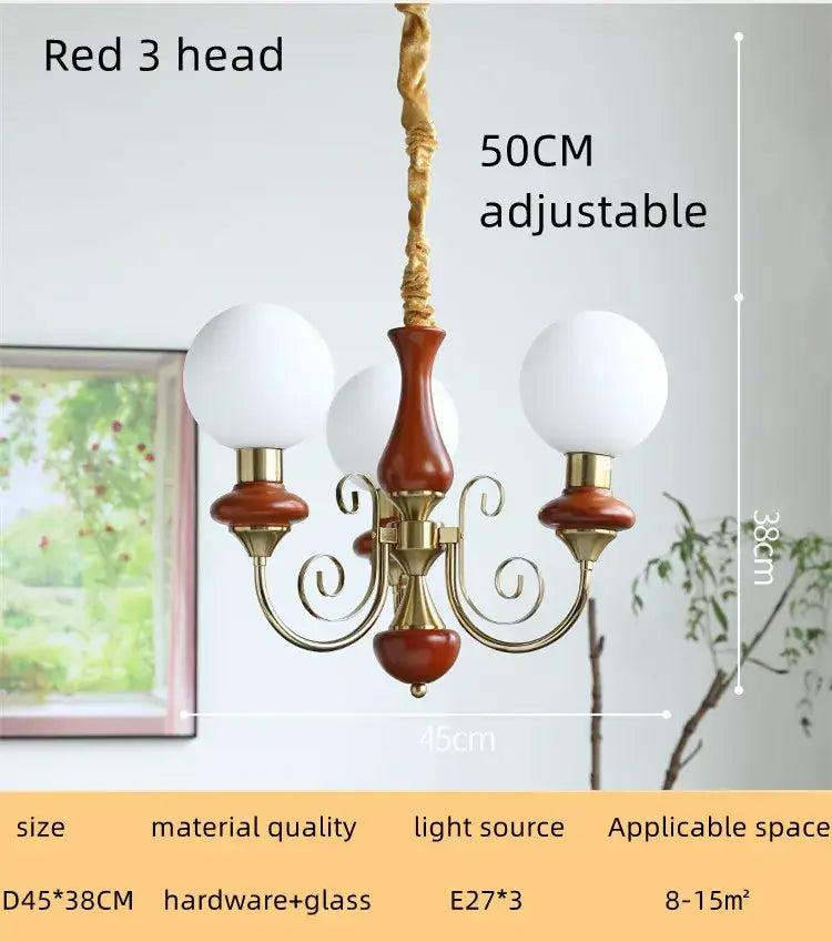 Red three-head style led chandelier with brass accents and frosted glass globes for decorbites cream style dining room light