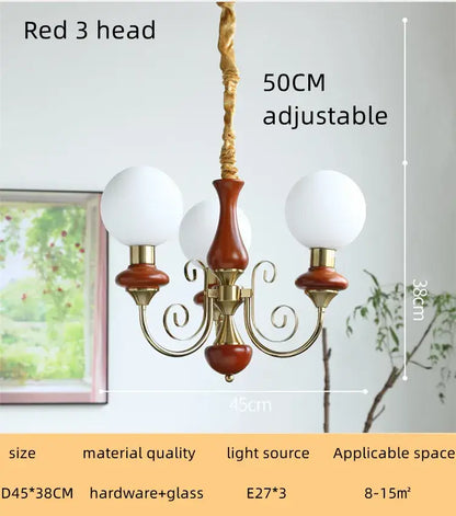 Red three-head style led chandelier with brass accents and frosted glass globes for decorbites cream style dining room light