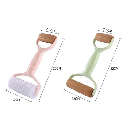 Pink and mint green plastic-handled decorbites dough roller with wooden heads and grid knife for dough roller rolling