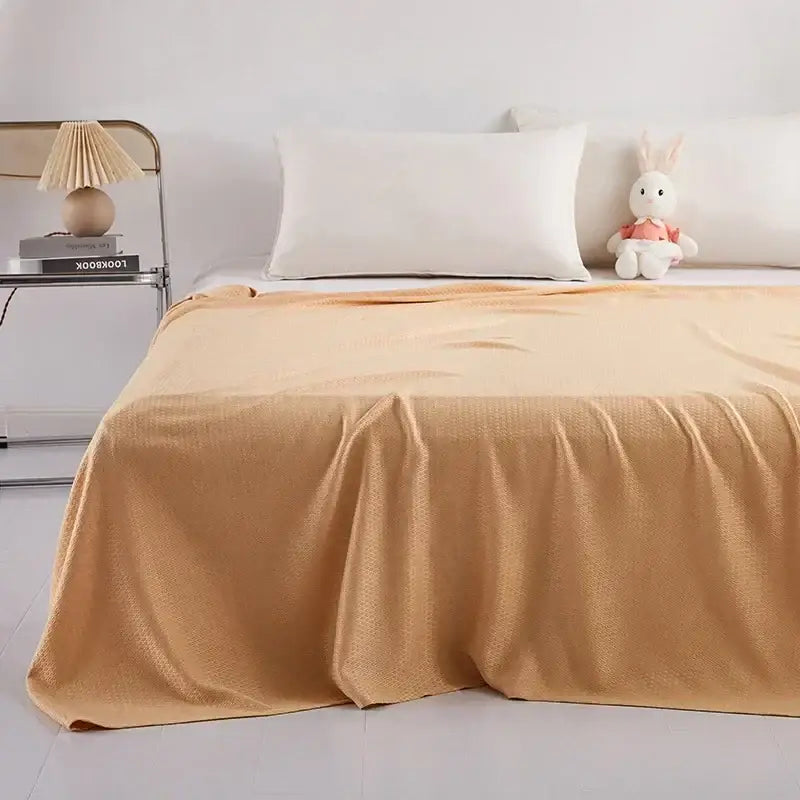 Warm beige textured bedspread in a bedroom setting featuring a mint green bamboo fiber cooling summer blanket decorbites bamboo fiber