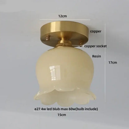A vintage ceiling light with brass copper base and off-white scalloped resin shade for decorbites blue flower glass decor