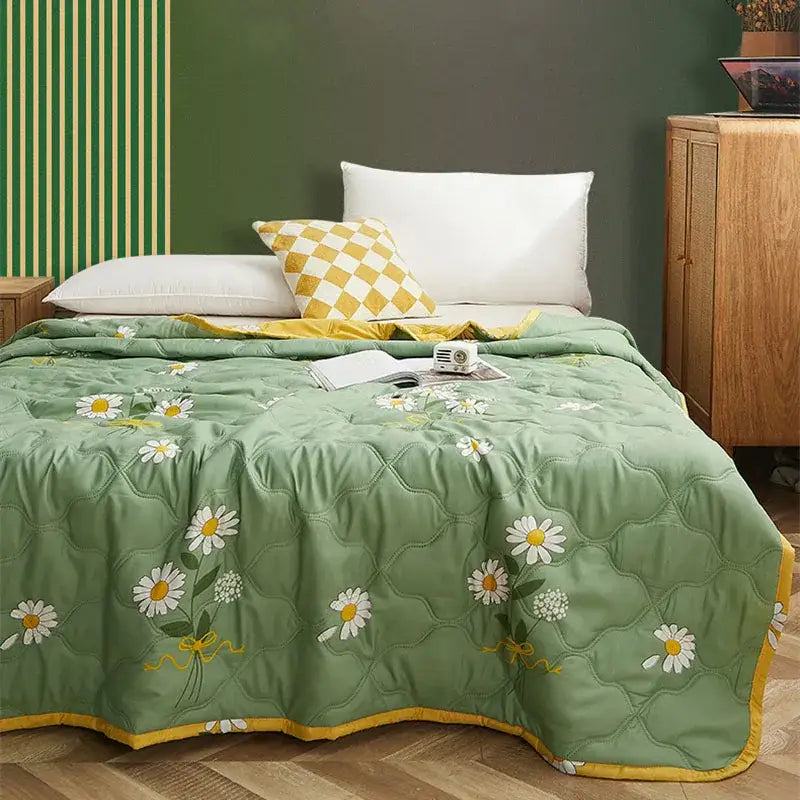 Mint green daisy print quilt set with diamond quilted green blanket featuring white daisy embroidery and yellow trim decorbites daisy print