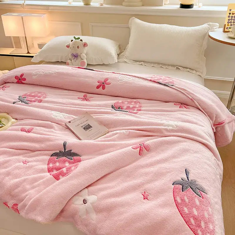 Pink strawberry-themed plush blanket with embroidered strawberries flowers and stars paired with mint green dinosaur patterns snowflake velvet blanket for decorbites dinosaur patterns bedroom decor