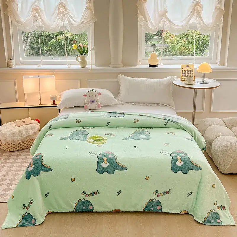 Mint green snowflake velvet blanket with playful dinosaur patterns in teal pink and yellow for bedroom decorbites decor