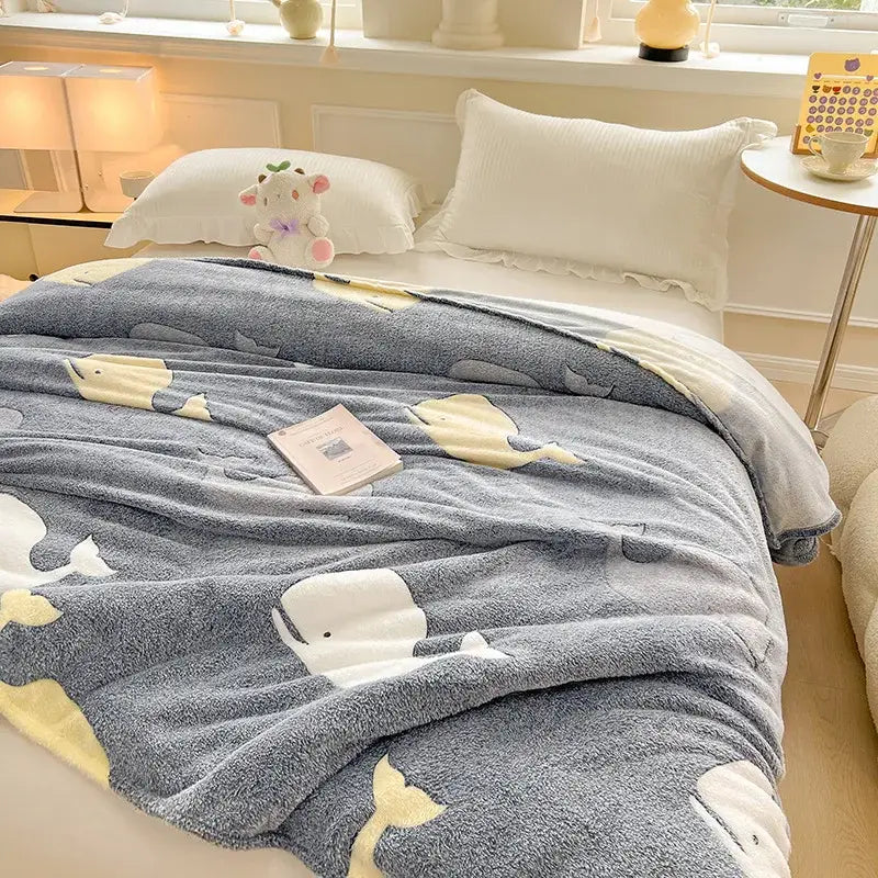 Gray plush blanket with white and yellow whale patterns complementing decorbites dinosaur patterns snowflake velvet bedroom decor