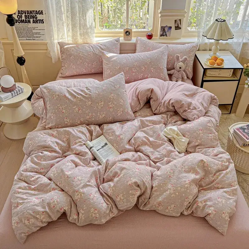 Pink floral-patterned duvet cover set featuring soft textured fabric and pastel tones for bedroom use