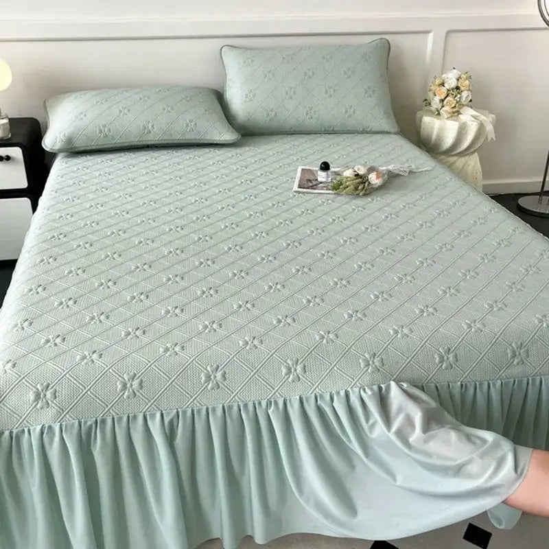 Mint green floral quilted bed skirt set with light green quilted bedspread and ruffled hem for bedroom mattress mat