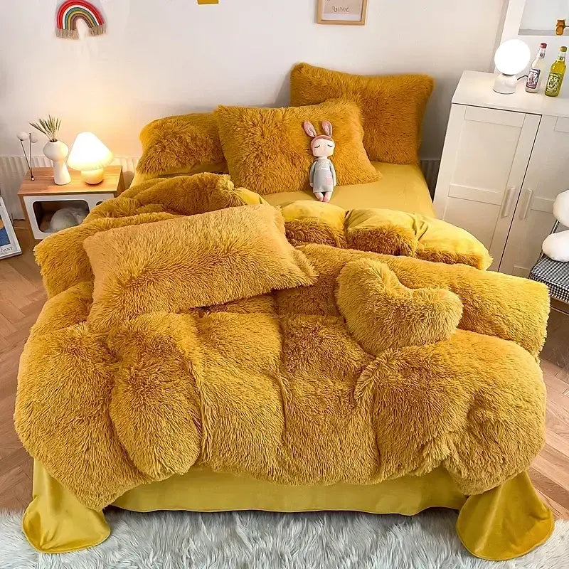 Golden-yellow plush fluffy faux fur bedding set with matching pillows and heart-shaped accent pillow by decorbites