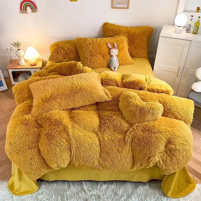 Golden-yellow plush fluffy faux fur bedding set with matching pillows and heart-shaped accent pillow by decorbites