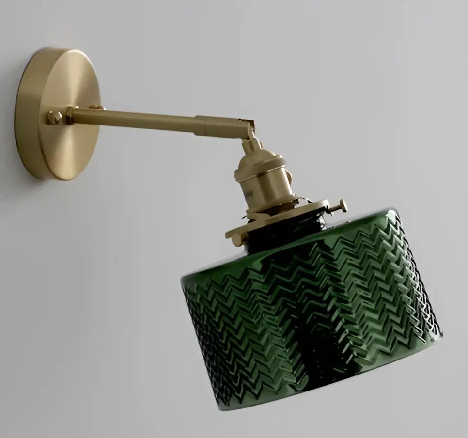 Mint green fluted glass led wall lamp sconce with textured chevron pattern mounted on brass arm for bedroom lighting