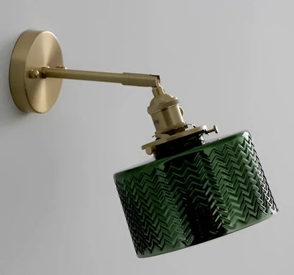 Mint green fluted glass led wall lamp sconce with textured chevron pattern mounted on brass arm for bedroom lighting