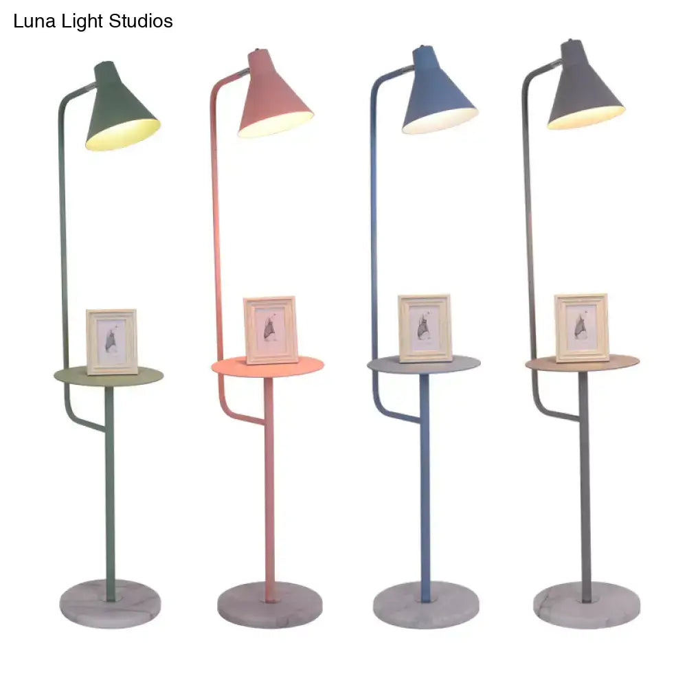 Four decorbites™ macaron floor lamps with slender metal frames and funnel shaped metal shades in pastel colors