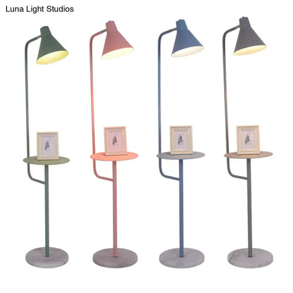Four decorbites™ macaron floor lamps with slender metal frames and funnel shaped metal shades in pastel colors