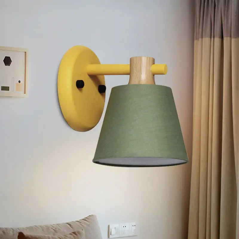 Mint green nordic bucket wall lamp with wood accent and sage green fabric shade designed as a bucket wall lamp