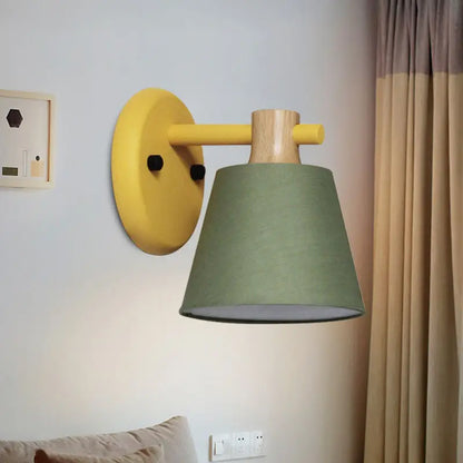 Mint green nordic bucket wall lamp with wood accent and sage green fabric shade designed as a bucket wall lamp