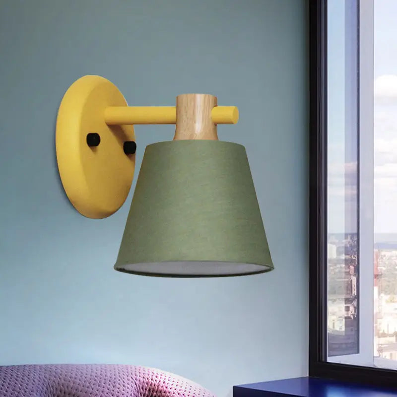 Yellow and wood-finished bucket wall lamp with olive green fabric shade and wood accent for bedroom use