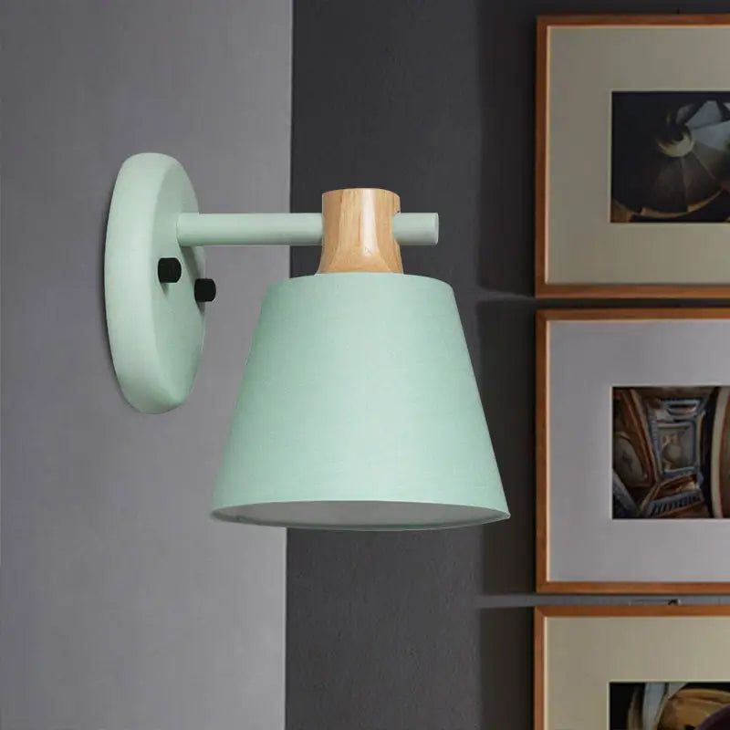 Mint green bucket wall lamp with matte finish and natural wood accent in minimalist nordic design for bedroom use