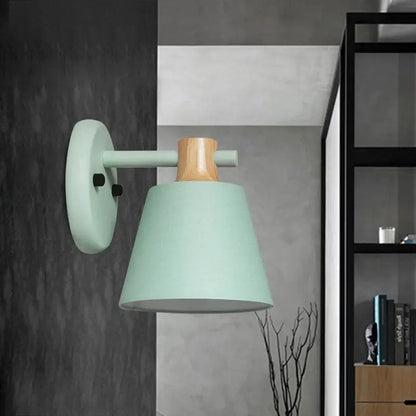 Mint green nordic bucket wall lamp with matte finish, natural wood accent, and cylindrical shade for bedroom use