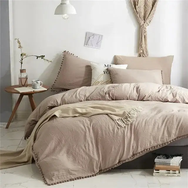 Beige textured duvet cover set with matching pillowcases and fringe trim for a mint green quilted pom pom cover set
