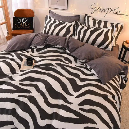 Black and white zebra-striped bedding set with bold graphic pattern complementing decorbites cartoon print bedroom decor