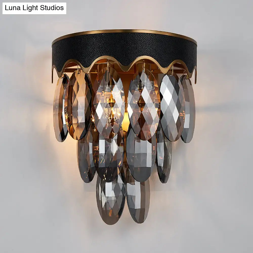 Modern 3-tier black and gold crystal wall lamp with textured base and amber and gray faceted droplets for wall mount lighting