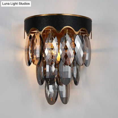Modern 3-tier black and gold crystal wall lamp with textured base and amber and gray faceted droplets for wall mount lighting
