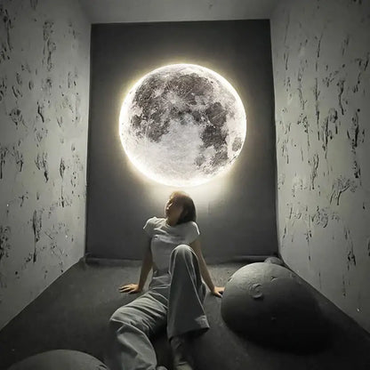 A glowing detailed 3d creative moon earth led wall lamp mounted on a dark wall for bedroom decorbites creative moon decor