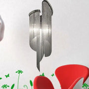 Modern abstract silver wall light with tassel aluminum shade featuring cascading vertical elements for living room use