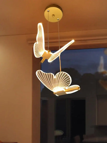 Modern acrylic gold-toned butterfly led chandelier with illuminated translucent wings for bedroom pendant lighting decorbites butterfly led