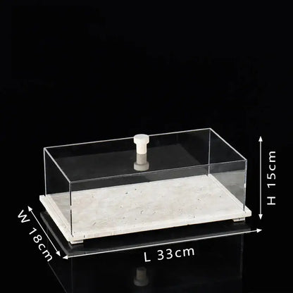 Modern acrylic display case with clear rectangular acrylic display and white travertine base for dining room use