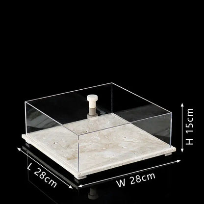 Modern acrylic display case with clear acrylic body and white travertine base for elegant dining room presentation