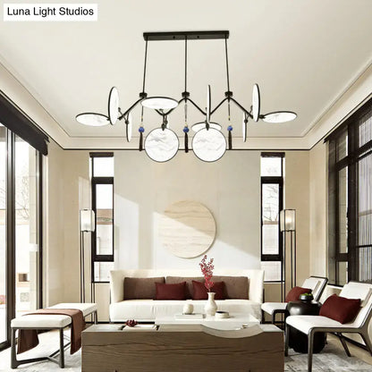 Modern black metal island lamp with white marble-effect shades and blue tassels featuring acrylic led lighting