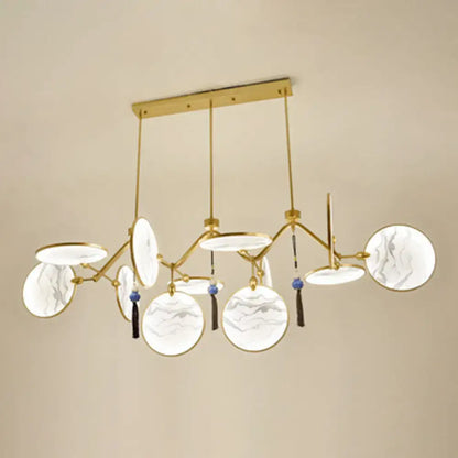 Gold-toned decorbites™ modern acrylic led island lamp with circular marble-patterned glass shades and blue tassels