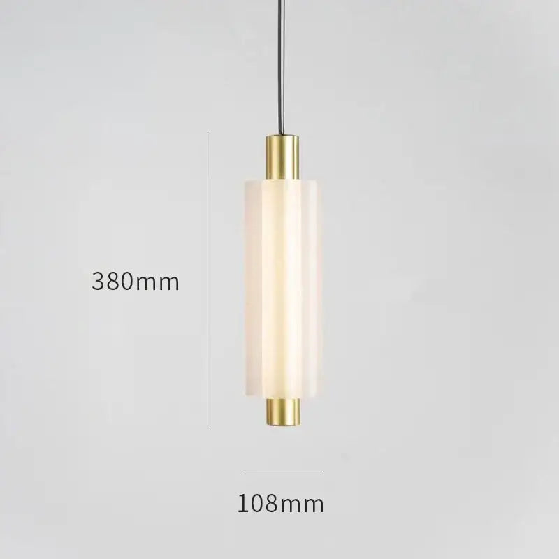 A modern acrylic minimalist pendant light with warm frosted glass and polished brass accents for bedroom decorbites