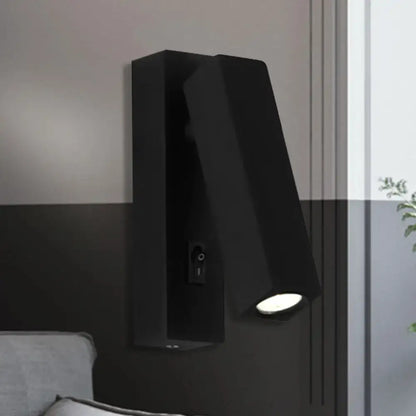 Modern black silver wall-mounted reading lamp with adjustable head and sleek angular design for bedroom use