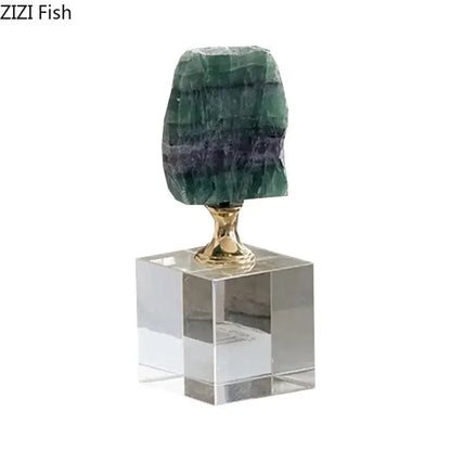 A polished green and purple layered agate fluorite geode on a gold-toned decorbites crystal base for living room decor