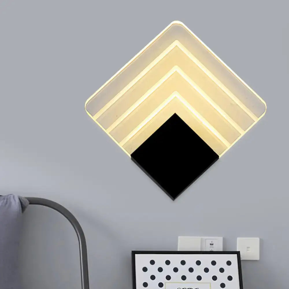 Modern aged silver and black square led wall sconce with diamond-shaped layered translucent panels for bedroom lighting