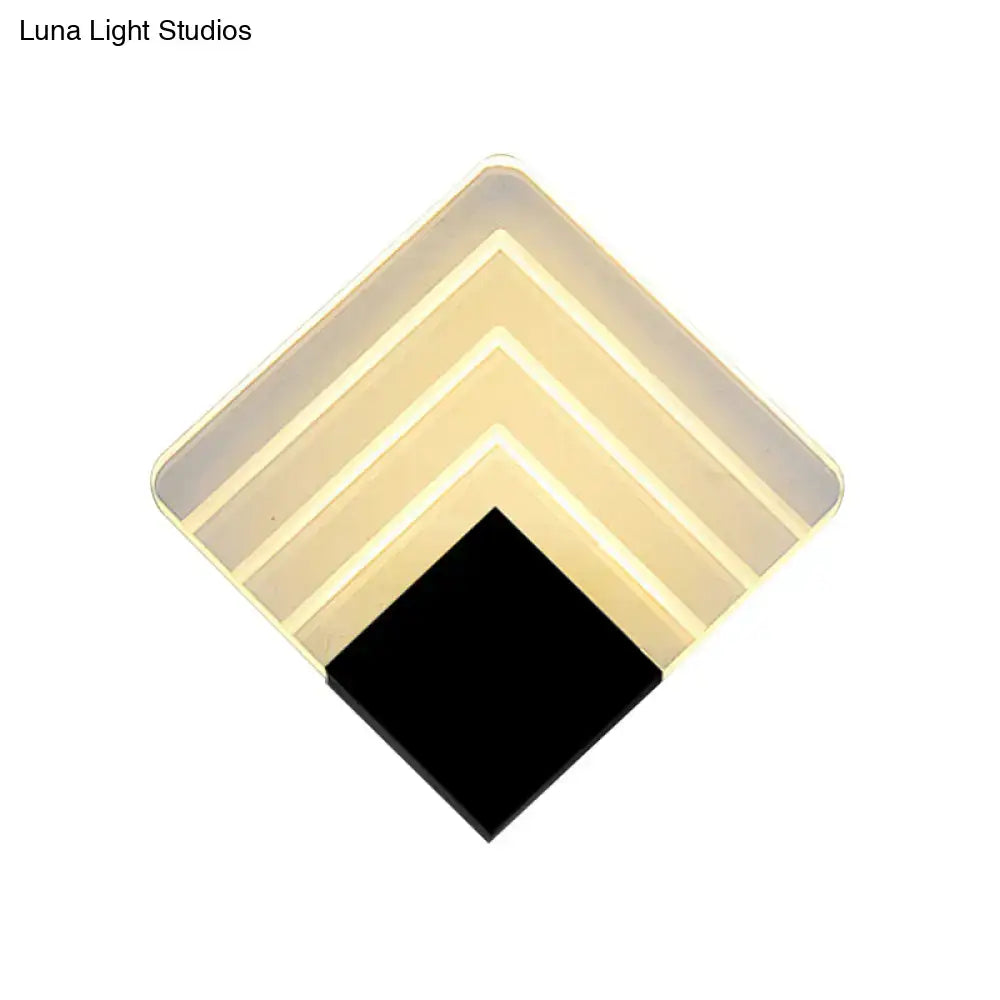 Modern aged silver and black square led wall sconce with geometric layered design and translucent beige panels for bedroom lighting