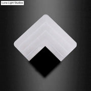 White square-shaped corner protector with black inner section for modern aged silver and black square led wall sconce