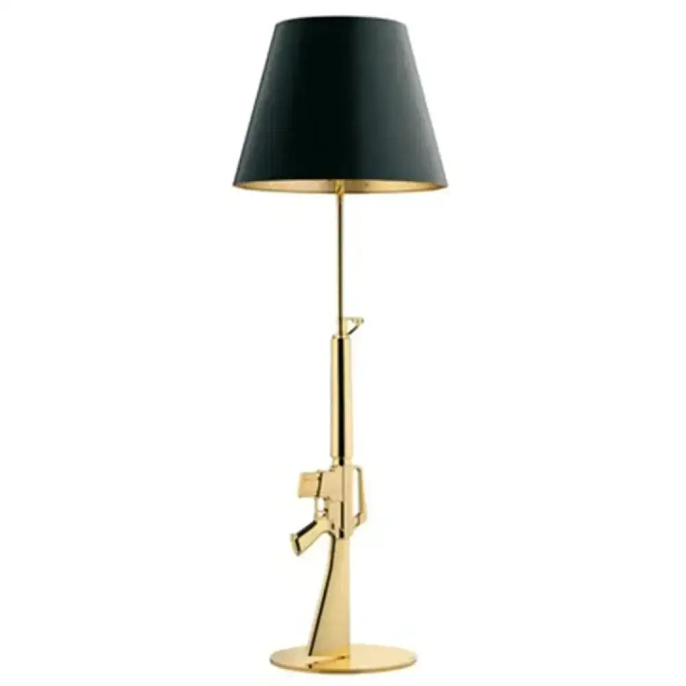Modern ak47 gun lounge floor lamp with gold-colored rifle body and black conical shade with silvery gold lustre interior