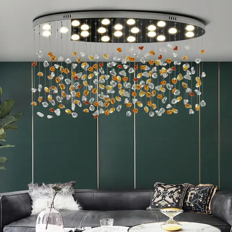 Modern oval ceiling light fixture with silver frame and cascading amber gold clear crystal stone chandelier decorbites colorful crystal